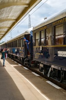 Ruse city, Bulgaria - August 29, 2017. The legendary Venice Simplon Orient Express is ready to depart from Ruse Railway station. Chief wagon. The luxury train travels between Paris and Istanbul.