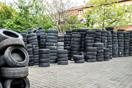 Sibiu, Romania - May 04, 2019. Used tire stacks in Workshop vulcanization yard