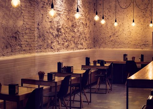 tables and empty chairs at the bar
