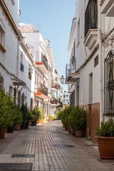 Marbella, Spain - June 27th, 2018. Typical old town street in Marbella, Costa del Sol, Andalusia, Spain, Europe