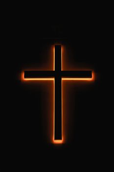 A led glowing church cross light in night