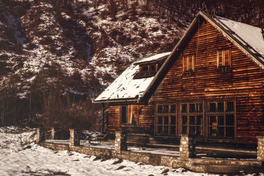 abandoned cottage in winter setting, Orlat commune, Sibiu county, Romania