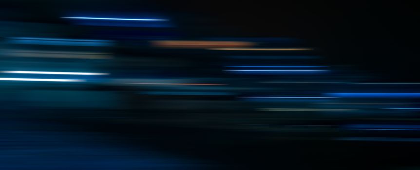 Abstract light trails in the dark background, motion blur