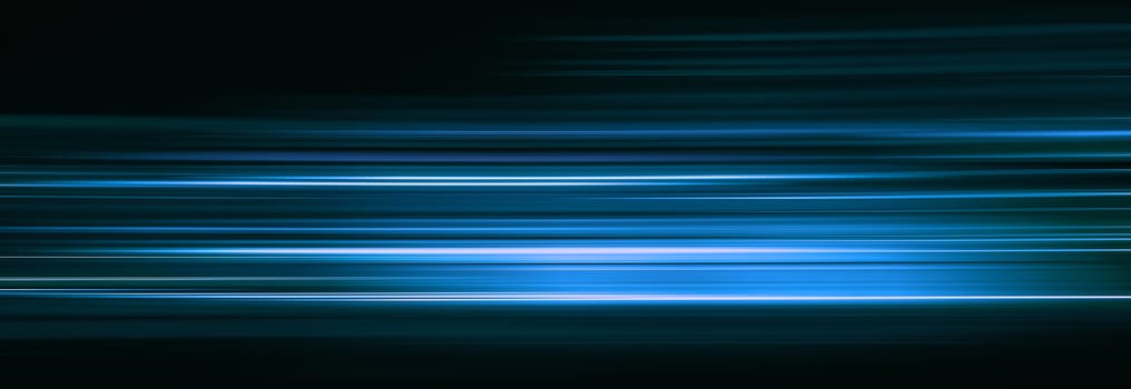 Abstract blue light trails in the dark, motion blur effect