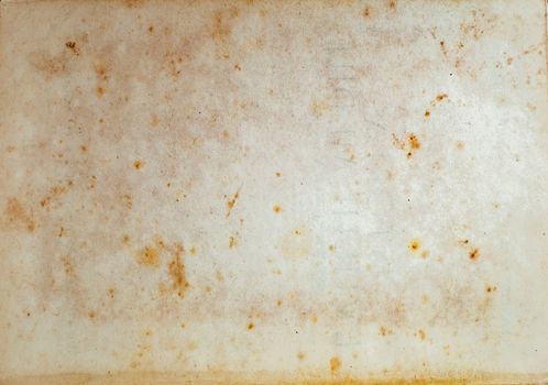 Aging, worn paper with water stains and rough edges