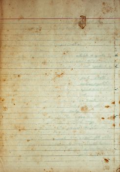 Aging, worn lined paper with water stains and rough edges