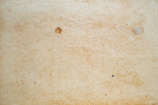 Aging, worn paper with water stains and rough edges