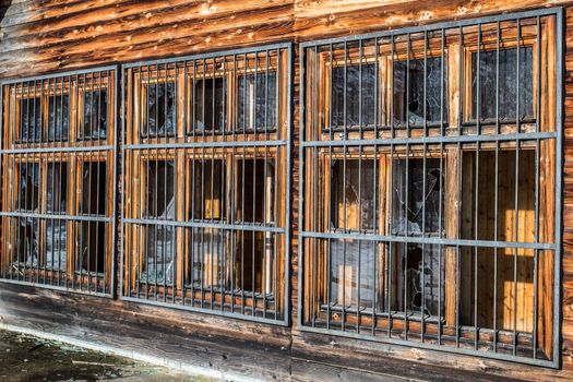 broken windows with metal grille