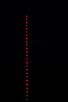 Blured red lights on black background, out of focus lights