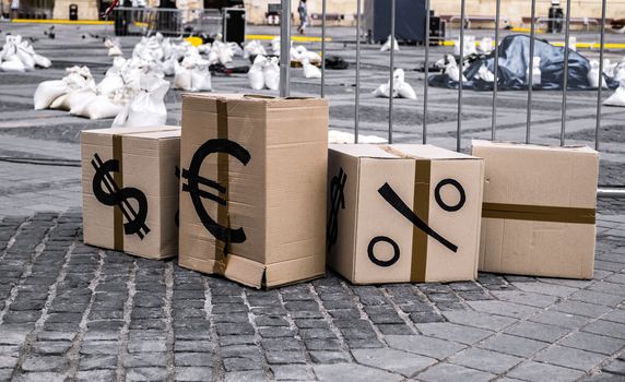 cartoon boxes with euro and dollar signs in Sibiu center, Romania