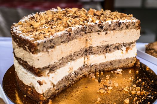 cake with nut on golden plate