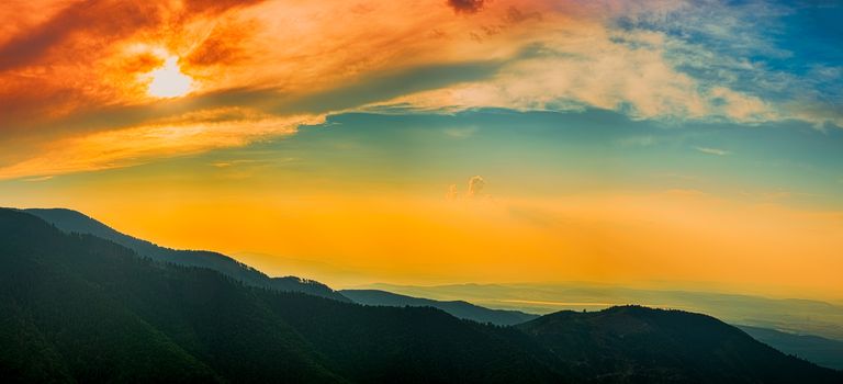 A play of colors at sunset in the mountains. Fagaras mountains, Romania, Sibiu county, Barcaciu cottage area,1550m