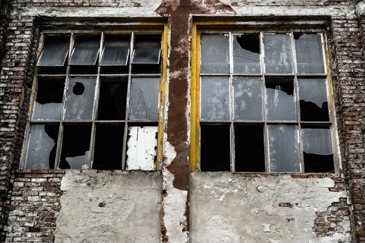 broken window of an industrial abandoned building