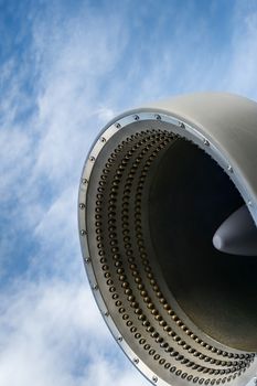 Close up professional artificial snow machine cannon on cloudy sky