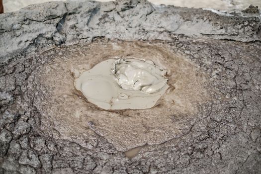 Close-up of bubbling mud in crater of mud volcano in Buzau county, Romania