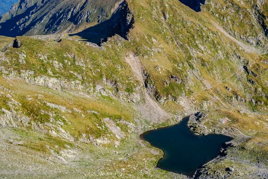 high mountains and glacier lake, Fagaras mountains,the saddle Podragului, Giurgiului bridge lake, Romania