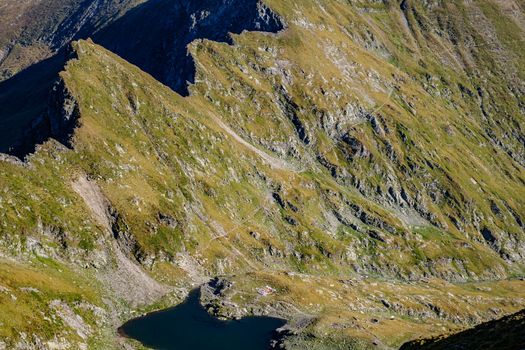 high mountains and glacier lake, Fagaras mountains,the saddle Podragului, Giurgiului bridge lake, Romania