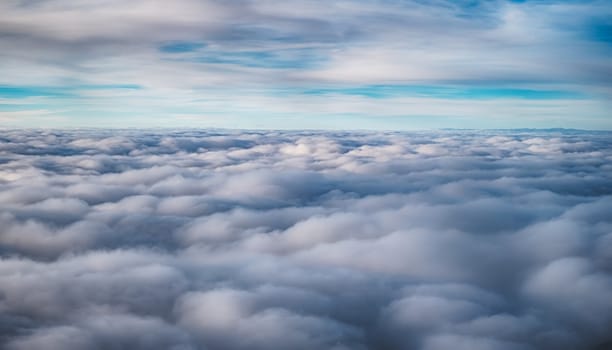 View over the clouds from airplane