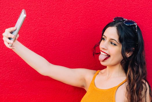 Portrait Of A Happy Young Woman Taking Selfie.