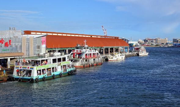 KAOHSIUNG, TAIWAN -- JULY 4, 2016: A view of the cross-harbor ferry pier with a ferry departing for Chijin Island.