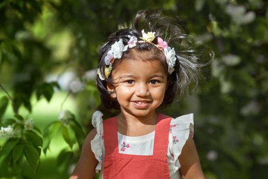 happy little girl in a summer Park