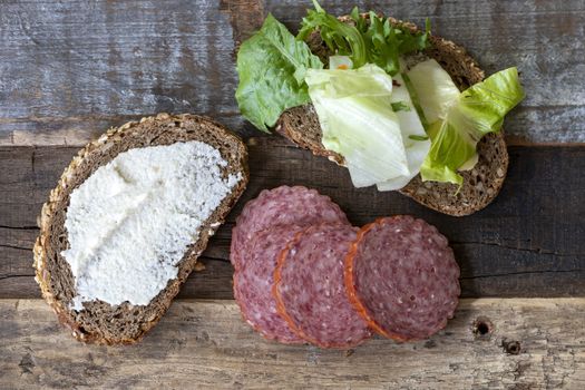 bread with horseradish spread and salami