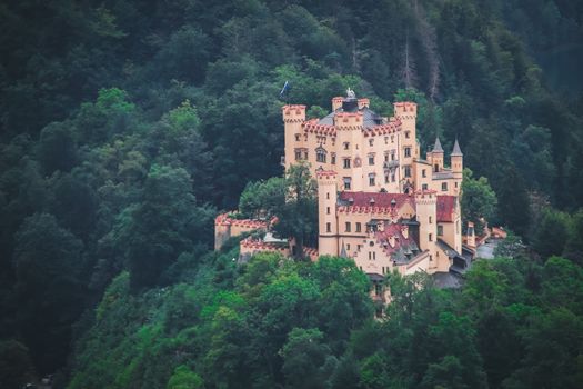 Top view Castle Hohenschwangau in Germany. The Royal Palace in Bavaria. The yellow famous palace is a tourist attraction.