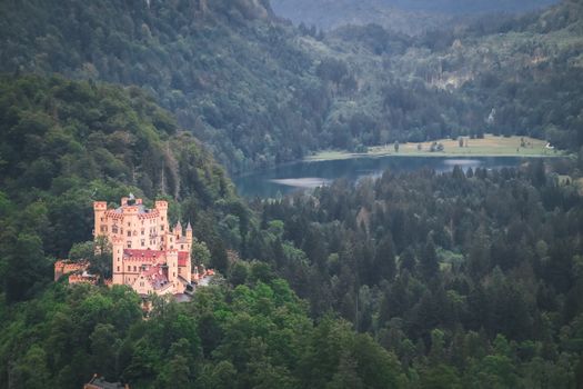 Top view Castle Hohenschwangau in Germany. The Royal Palace in Bavaria. The yellow famous palace is a tourist attraction.