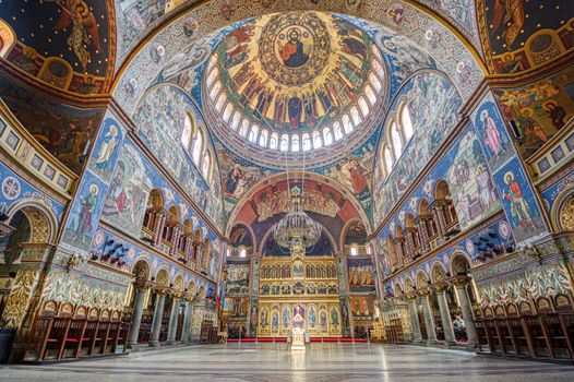 SIBIU, ROMANIA - Circa 2020: big church interior. Beautiful paintings in a European church. Concept of prayer religion and faith.