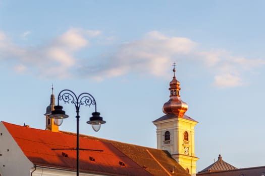 SIBIU, ROMANIA - Circa 2020: Old medieval town with cloudy blue sky. Beautiful tourist spot in eastern central Europe. Famous old medieval tower in Sibiu Romania