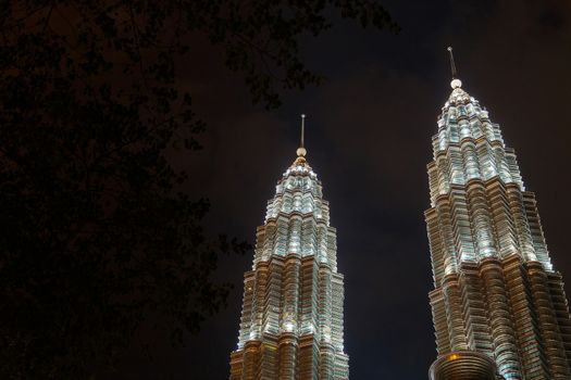 Kuala Lumpur, Malaysia - CIRCA 2017: Night view of KLCC or Petronas Towers, also known as the Petronas Twin Towers are twin skyscrapers in Kuala Lumpur.