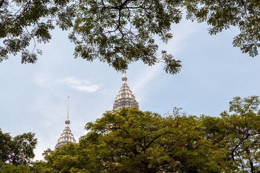 Kuala Lumpur, Malaysia - CIRCA 2017: view of KLCC or Petronas Towers, also known as the Petronas Twin Towers are twin skyscrapers in Kuala Lumpur.