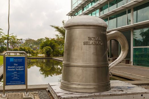 KUALA LUMPUR, MALAYSIA - CIRCA 2018: Tourists visit the production process of kitchenware,jewelry accessories from tin ore mixed with antimony and copper called Pewter. This factory is named Rayal Sal