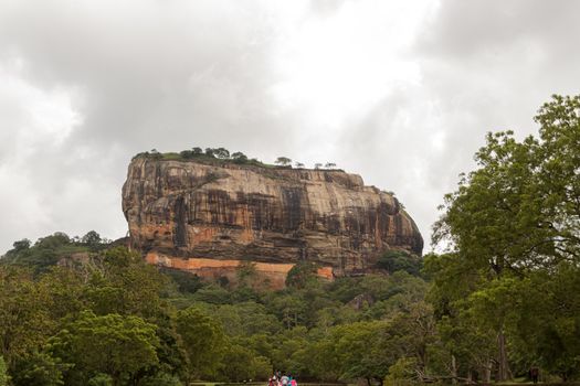 Beautiful ancient Lion Rock fortress in Sigiriya or Sinhagiri, located near the town of Dambulla, a famous Sri Lankan landmark. The Gardens of Sigiriya in the foreground.