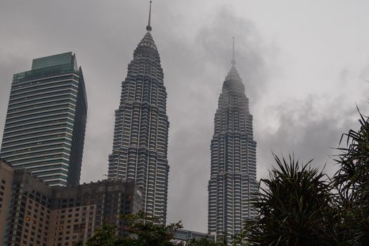 Kuala Lumpur, Malaysia - CIRCA 2017: view of KLCC or Petronas Towers, also known as the Petronas Twin Towers are twin skyscrapers in Kuala Lumpur.