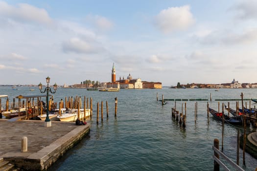 Venice, Italy - CIRCA 2020: View of an empty water canal in Venice Italy. Concept of the effects of lock down due to CoronaVirus COVID-19. Picturesque landscape.