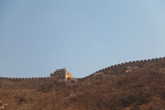 Beijing, China - CIRCA 2020: Great Wall of China in a green forest landscape at Mutianyu in Huairou District near Beijing, China. Autumn view of Grate Wall of China