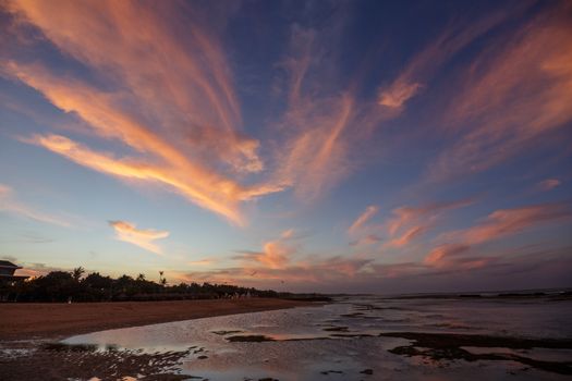 Landscape beautiful colorful golden sunset red, orange and purple sky Seychelles. Serenity and calm concept. The sun sets behind the horizon on a cloudy day.