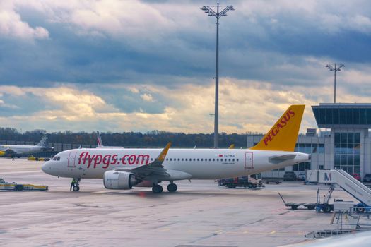 GERMANY, MUNICH - CIRCA 2020: Pegasus Airline Airplane grounded at Munich airport. Airplane grounded due to coronavirus pandemic concept