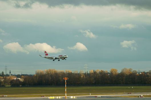 GERMANY, MUNICH - CIRCA 2020: Swiss Airline Airplane getting ready for landing at Munich airport. Travel concept