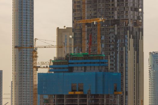 DUBAI, UAE - CIRCA 2020: Construction site for high rise skyscraper building. Concept of urbanization and tall buildings.