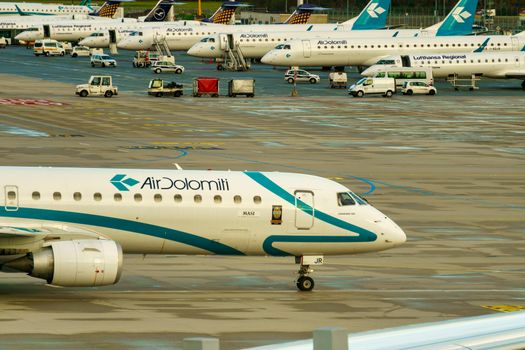 GERMANY, MUNICH - CIRCA 2020: Air Dolomiti Airline Airplane getting ready for landing or take off at Munich airport. Travel concept