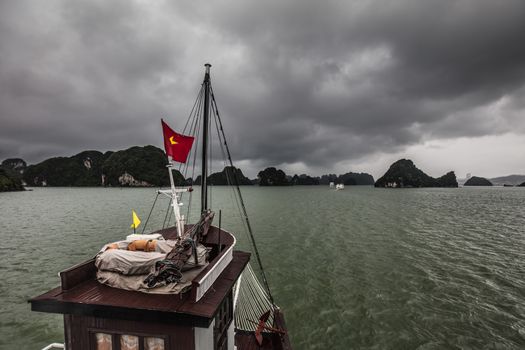 View throughout the islands of Ha Long Bay on a stormy summer's day in Ha Long Bay, Vietnam