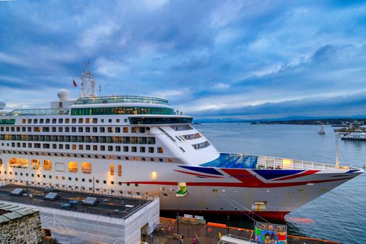 Norway, Oslo, CIRCA 2020: MV Aurora cruise ship of the P&O Cruises fleet docked in harbor due to covid19 restrictions. Concept of cruise ship stop due to pandemic.