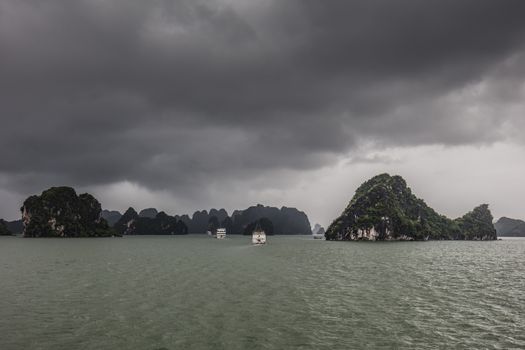 View throughout the islands of Ha Long Bay on a stormy summer's day in Ha Long Bay, Vietnam