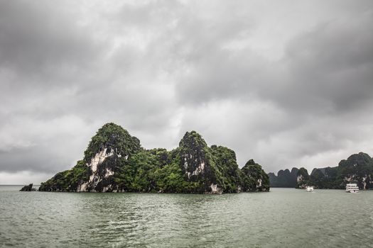 View throughout the islands of Ha Long Bay on a stormy summer's day in Ha Long Bay, Vietnam