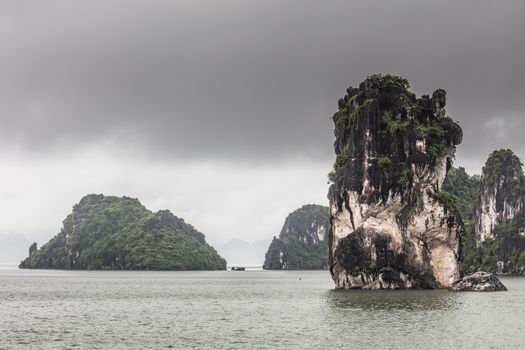 View throughout the islands of Ha Long Bay on a stormy summer's day in Ha Long Bay, Vietnam