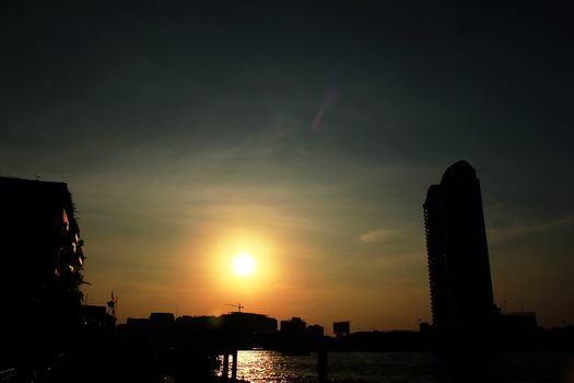 The silhouette of the black building Riverside Chao Phraya River, Thailand