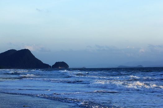 Sea water, mountains and blue skies.