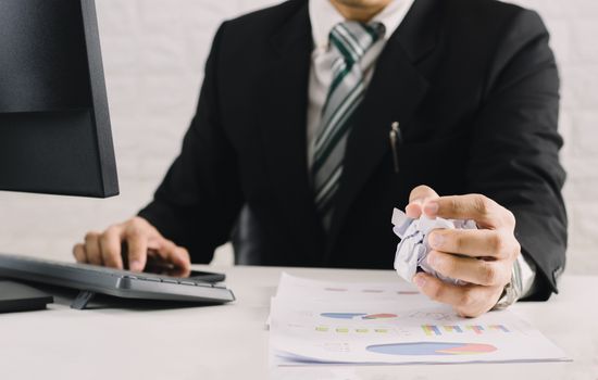 businessman emotions and fail concept crumpled paper on table with, unhappy no idea to thinking throwing papers in office